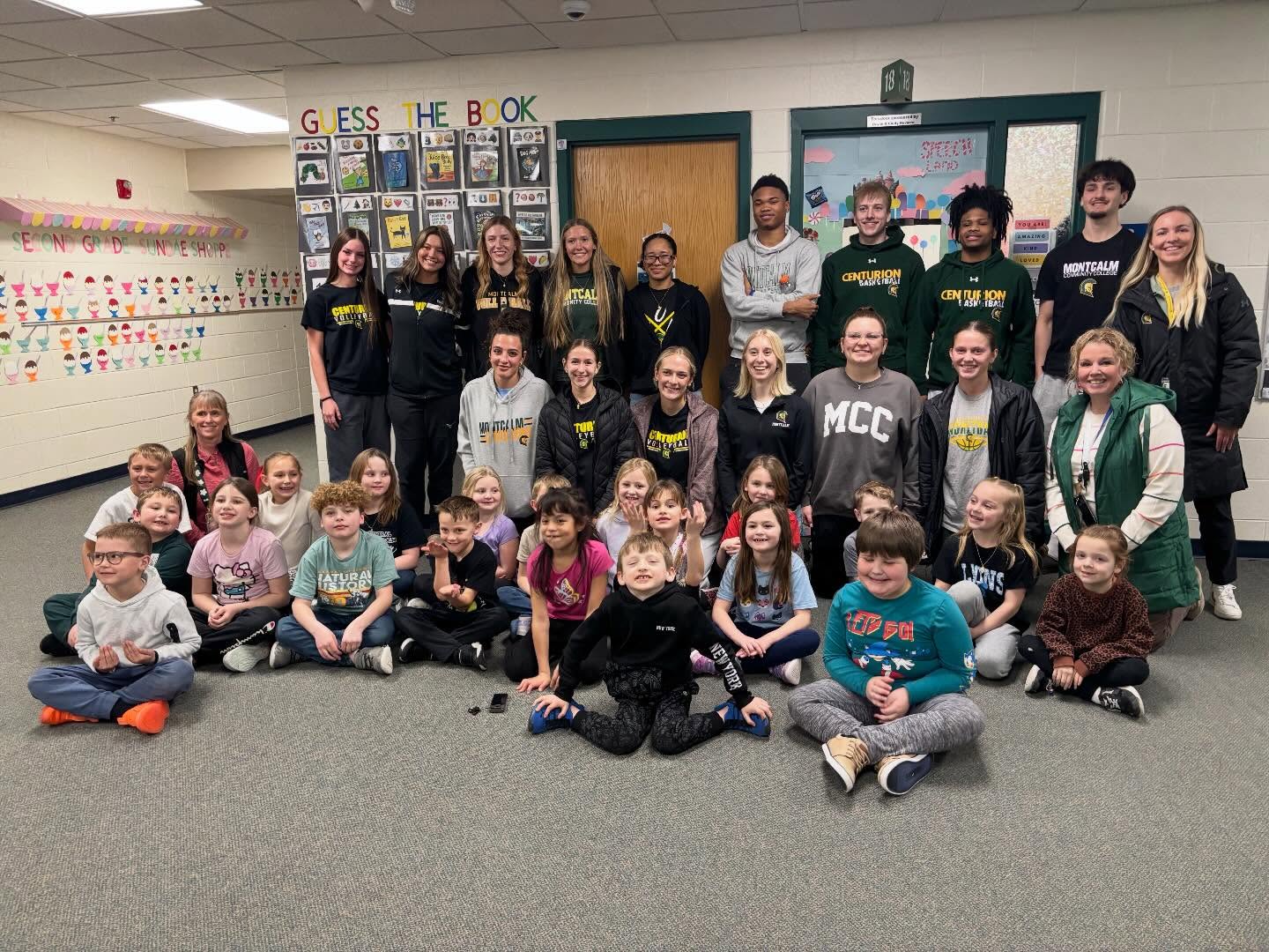 Group of MCC athletes with the 2nd grade class they're been writing to throughout the semester.